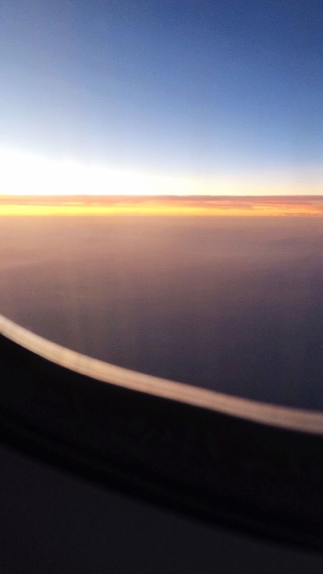 SUNSET SEEN THROUGH TRAIN WINDSHIELD