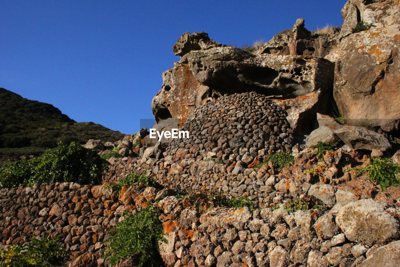 SCENIC VIEW OF MOUNTAIN AGAINST BLUE SKY