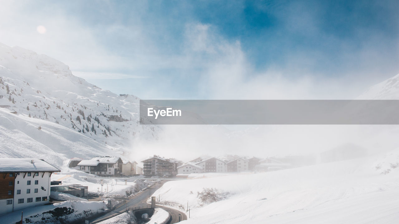 Panoramic view of snowcapped mountains against sky