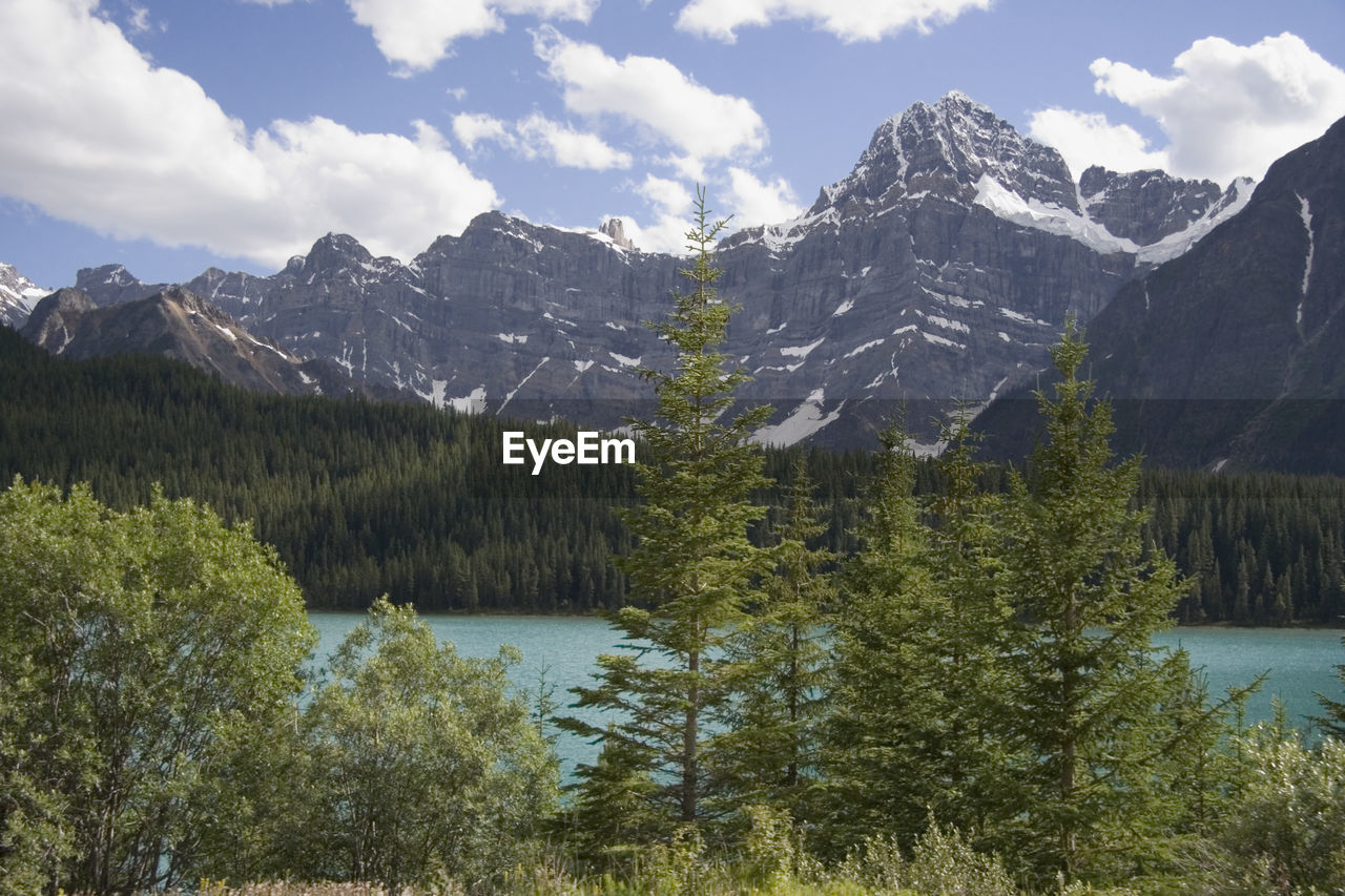 Scenic view of mountains against cloudy sky