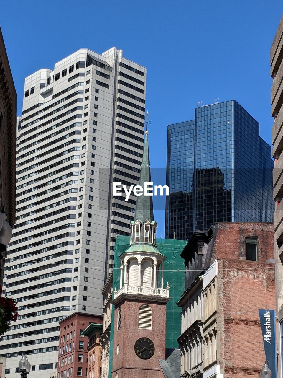 LOW ANGLE VIEW OF BUILDINGS AGAINST CLEAR SKY