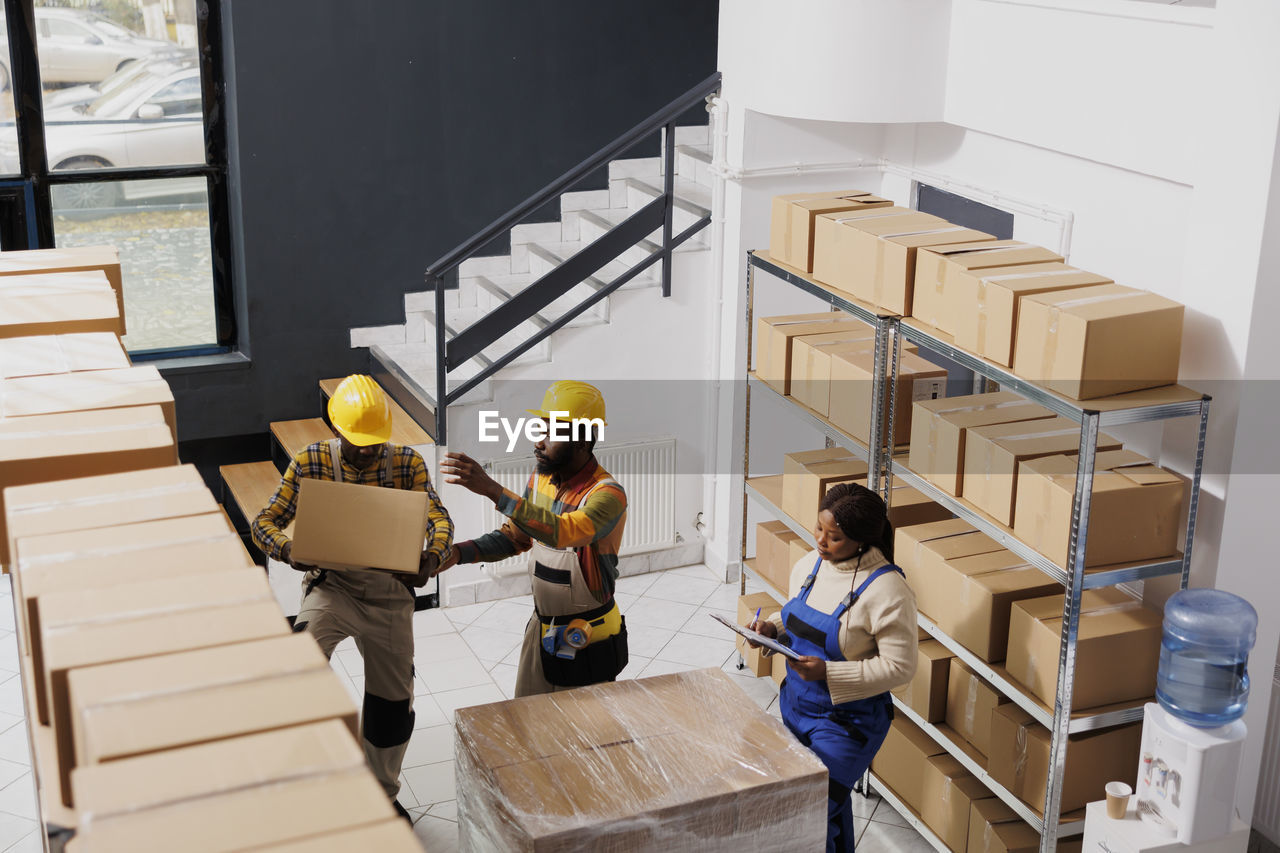 high angle view of man working in store