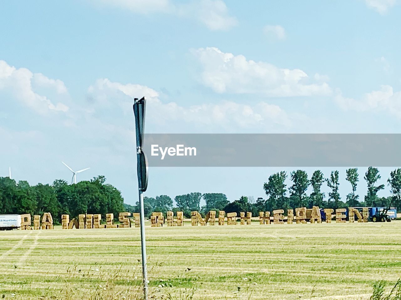 AGRICULTURAL FIELD AGAINST SKY