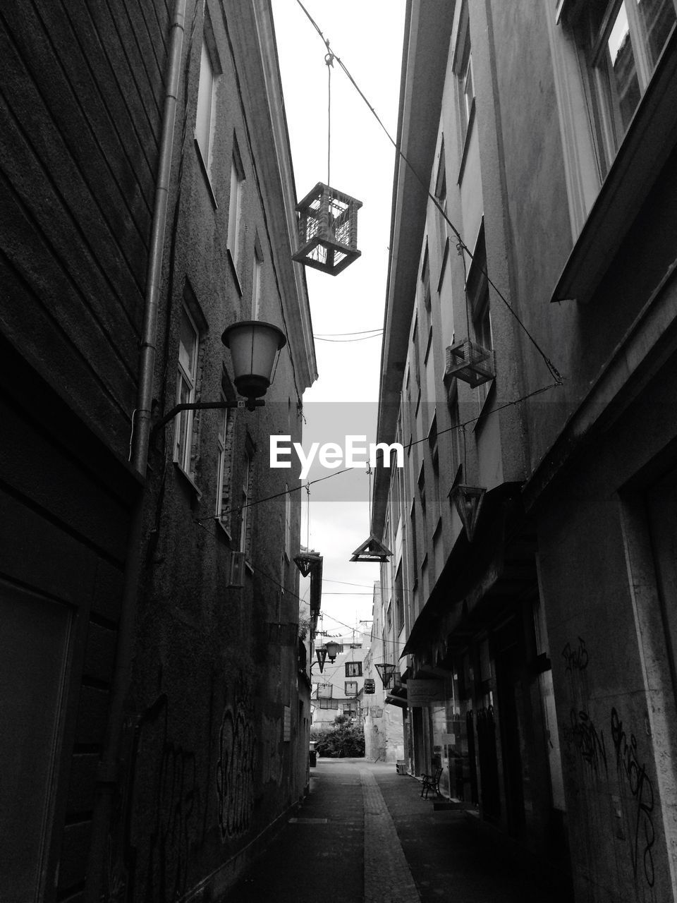 Narrow street along buildings