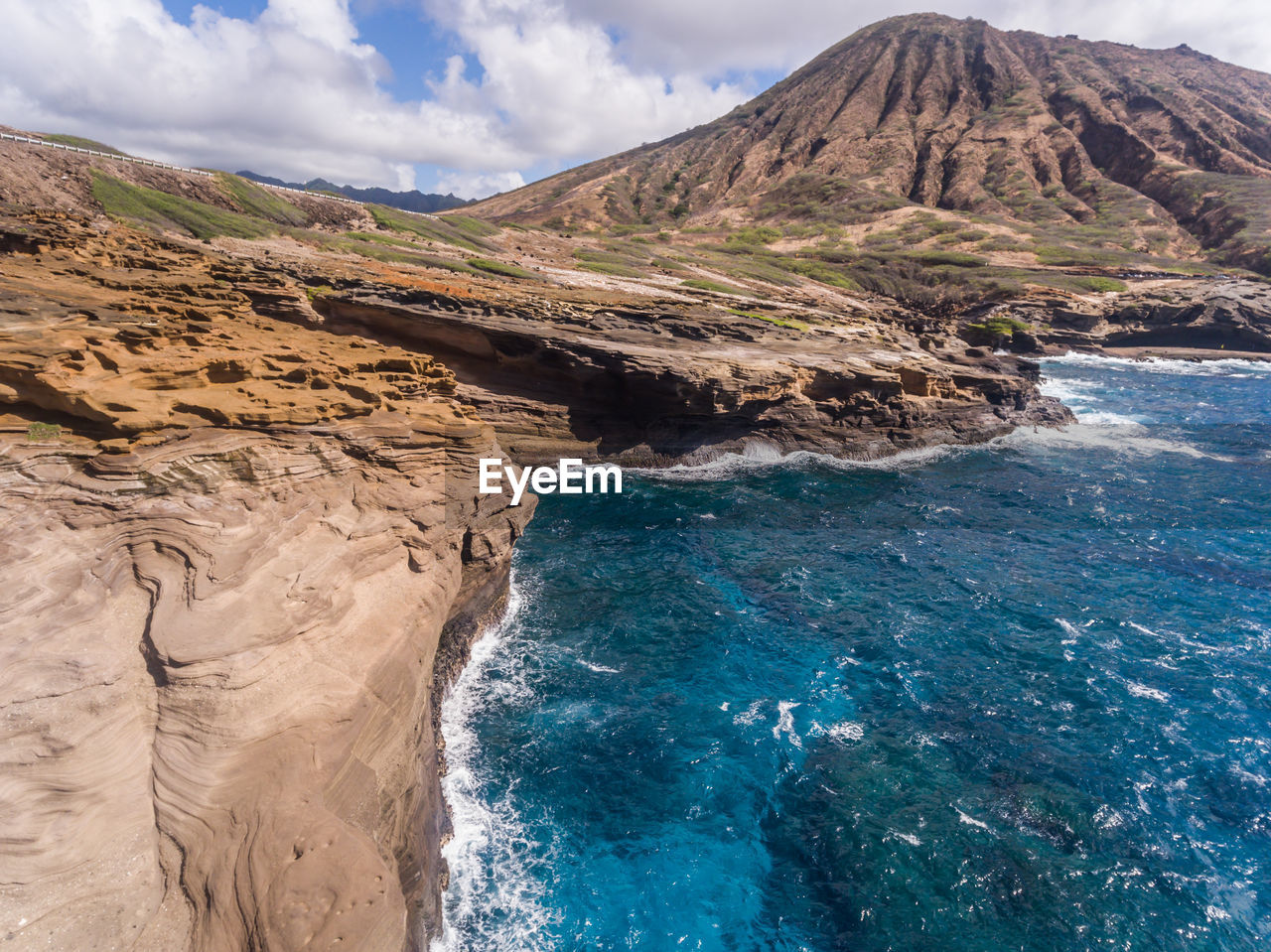 Scenic view of sea against cloudy sky