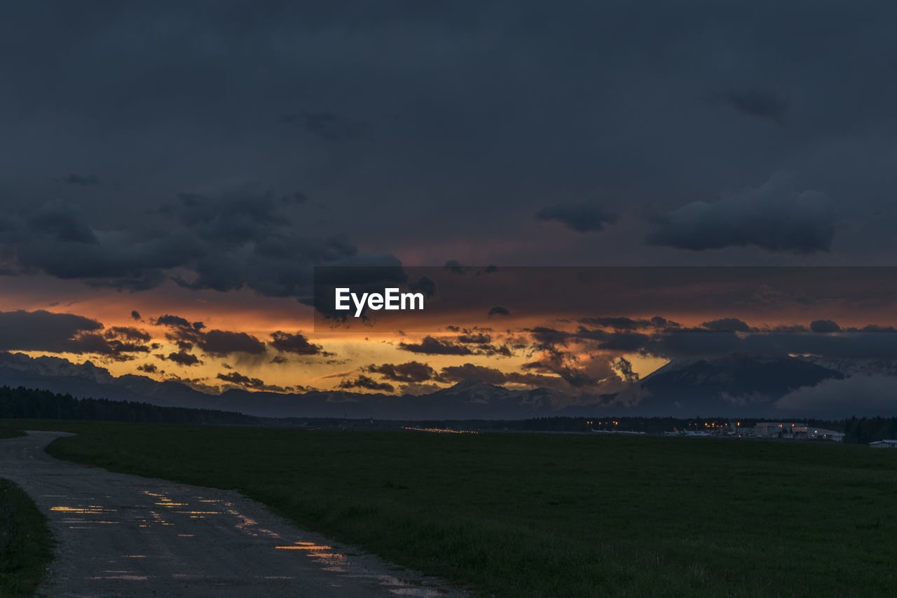 SCENIC VIEW OF DRAMATIC SKY DURING SUNSET