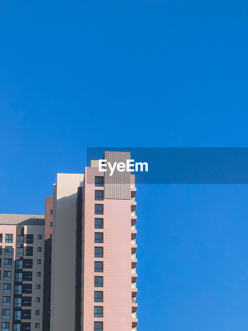 Low angle view of building against blue sky