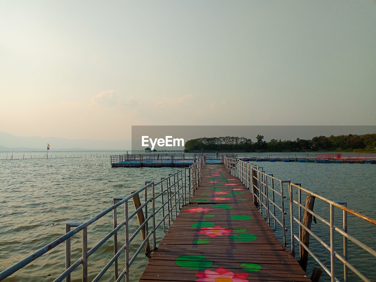 Pier over sea against sky