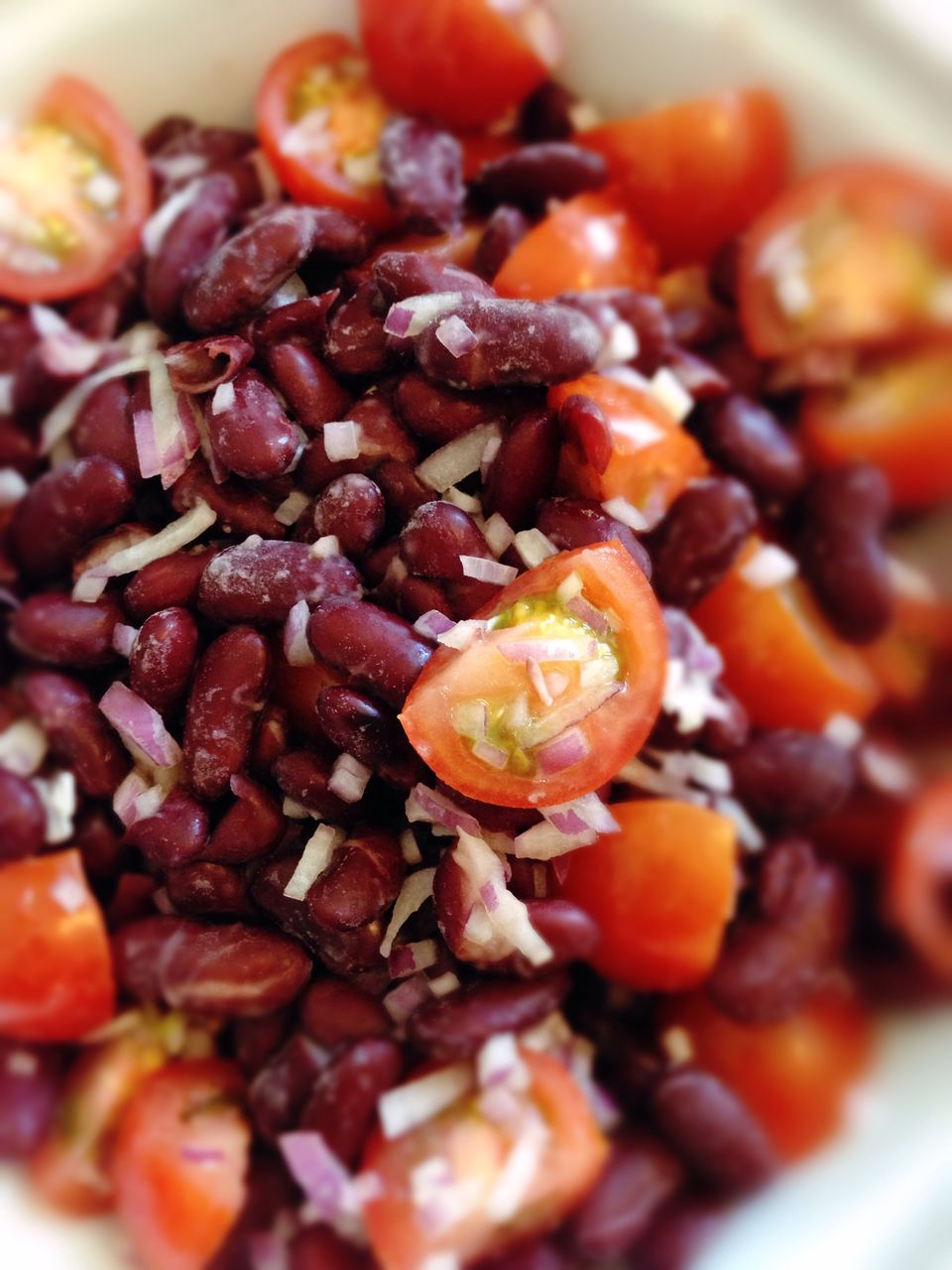 Close-up of sliced tomatoes with kidney beans