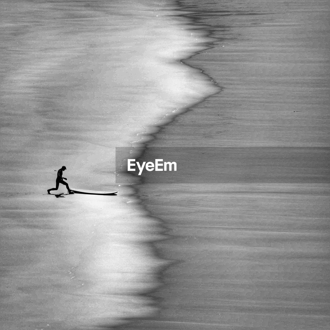 Silhouette man running on beach