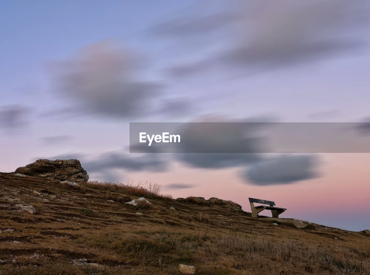 Scenic view of field against sky during sunset