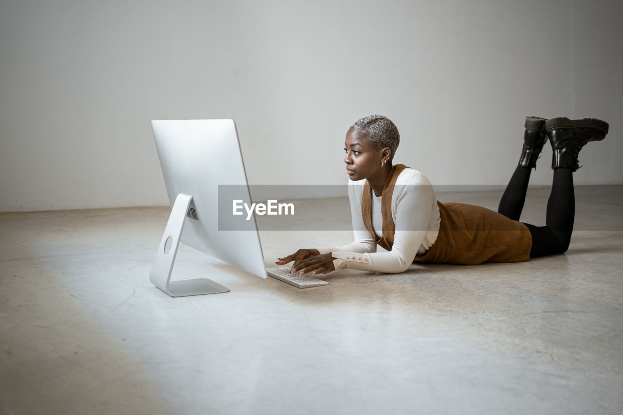 Businesswoman working on computer at home