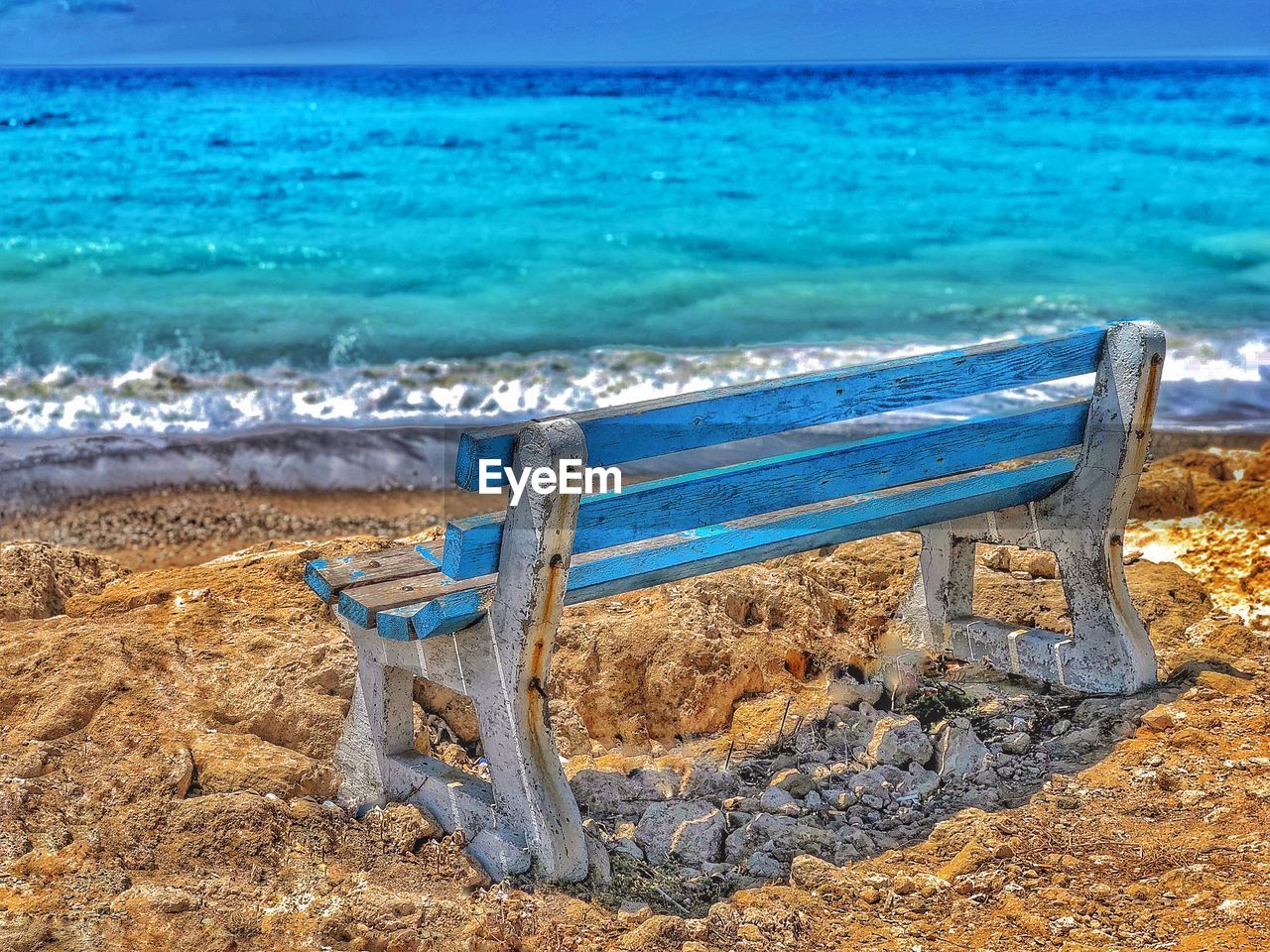 EMPTY CHAIRS ON BEACH