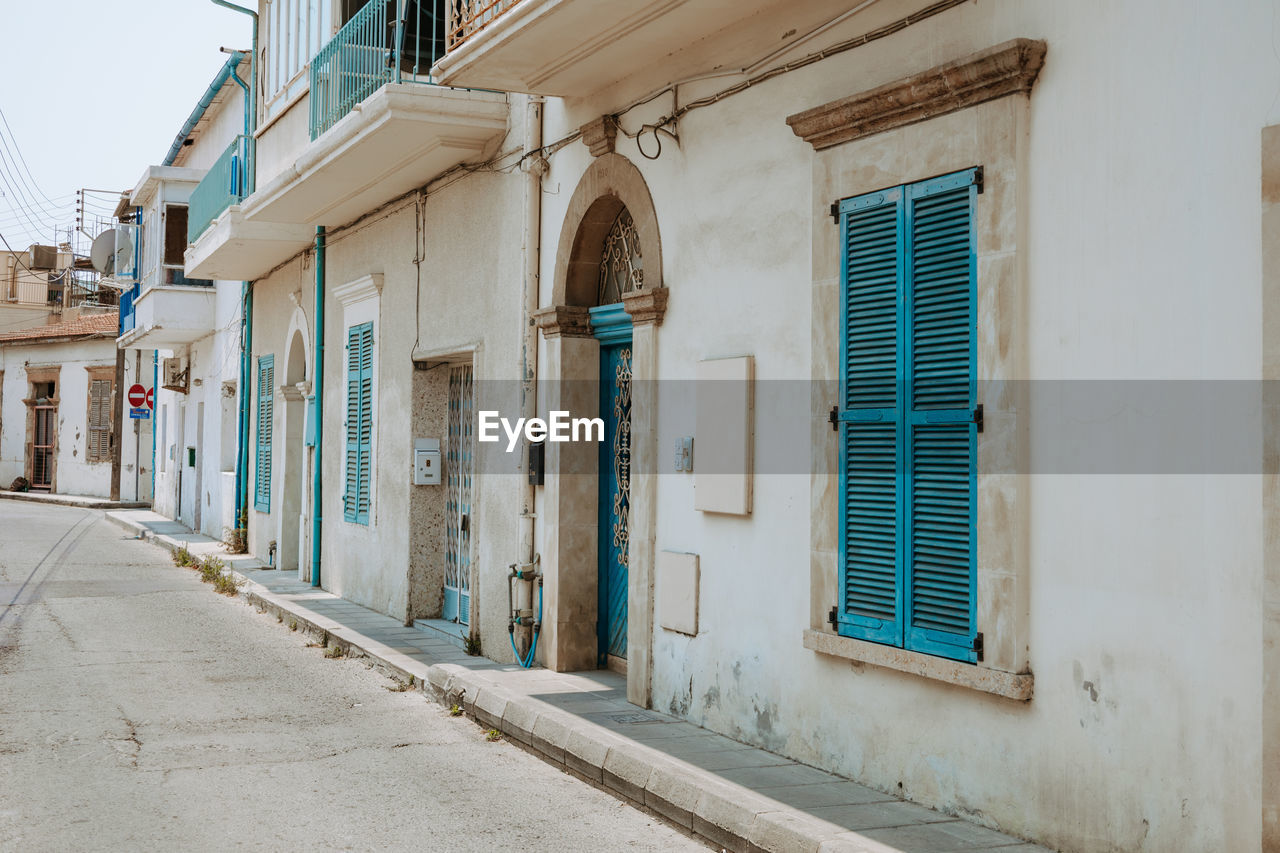 Empty alley amidst buildings in city