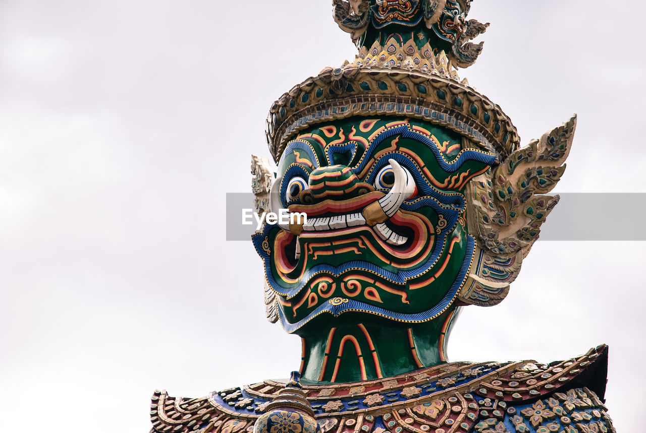 Low angle view of statue against sky