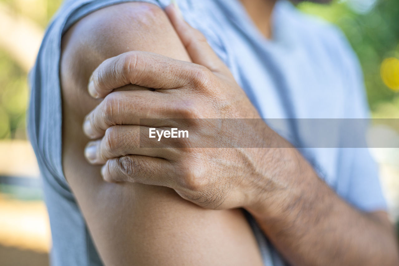 Close-up of man with shoulder pain