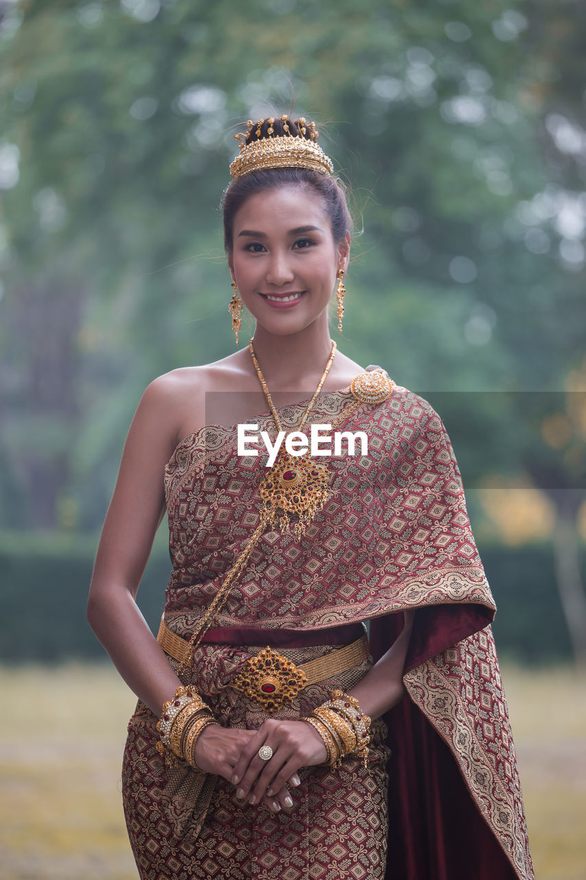 Portrait of smiling young woman in traditional clothing