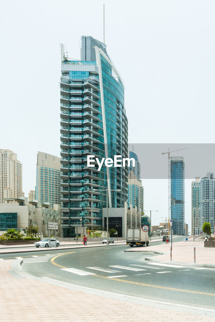 MODERN BUILDINGS AGAINST CLEAR SKY