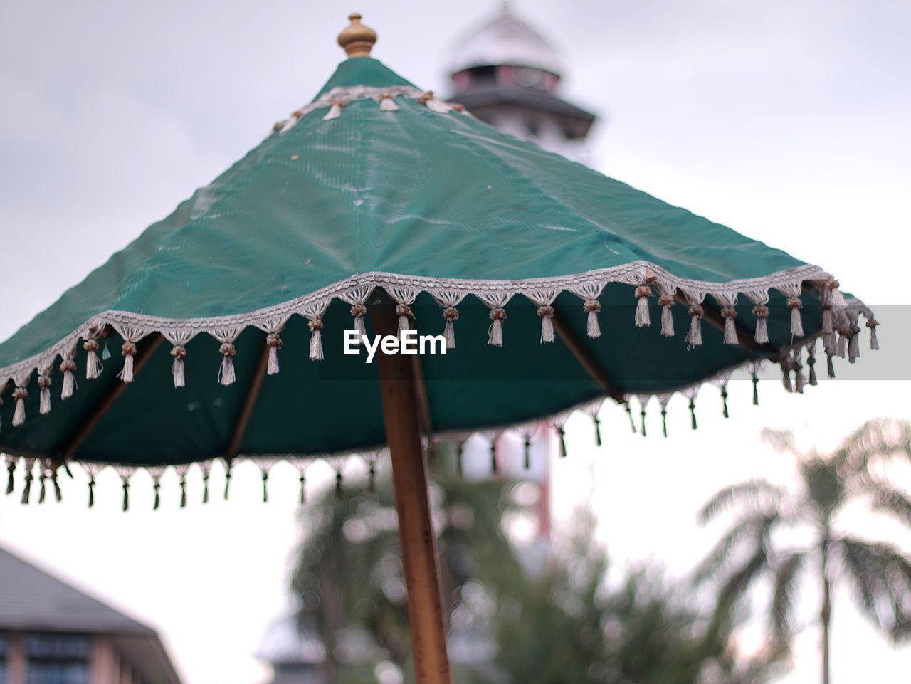 Low angle view of traditional umbrella against sky