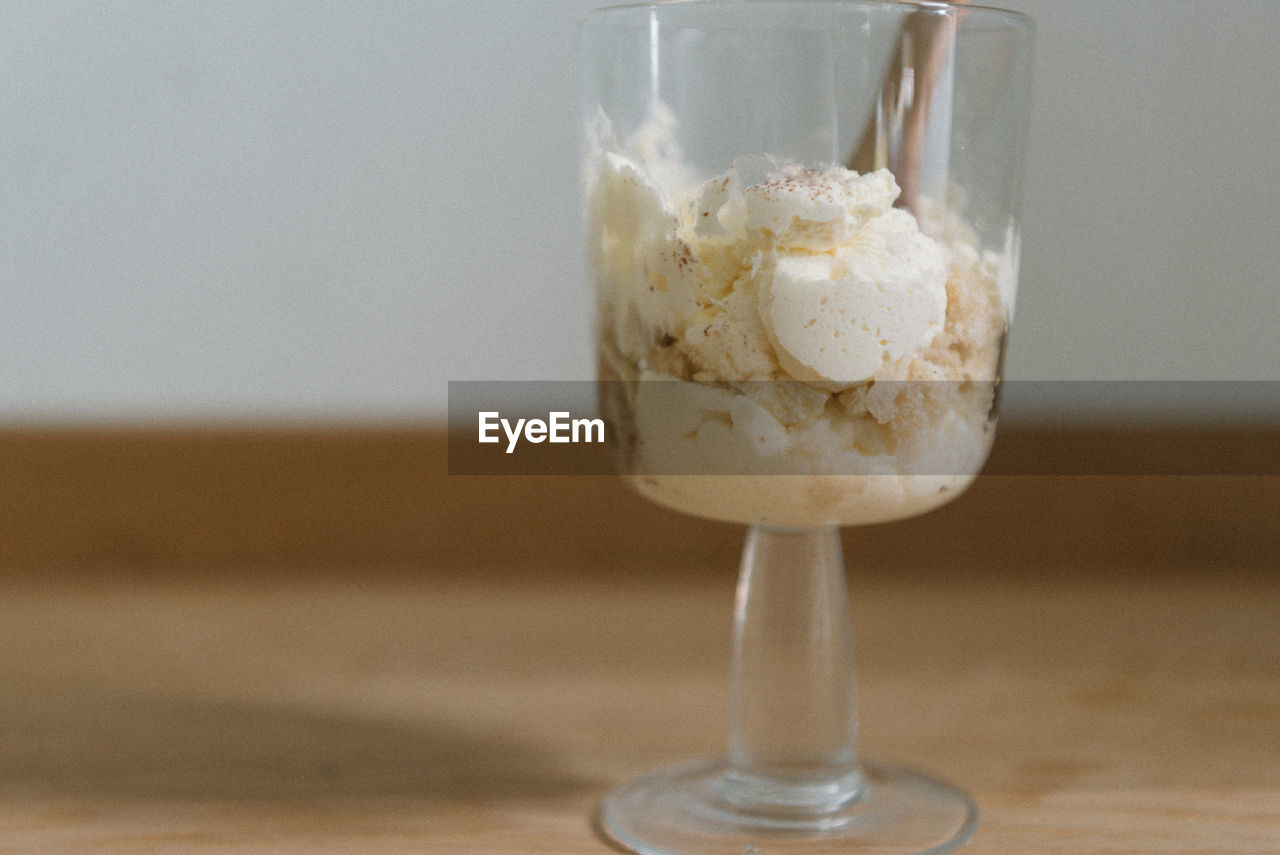 Close-up of ice cream in glass on table