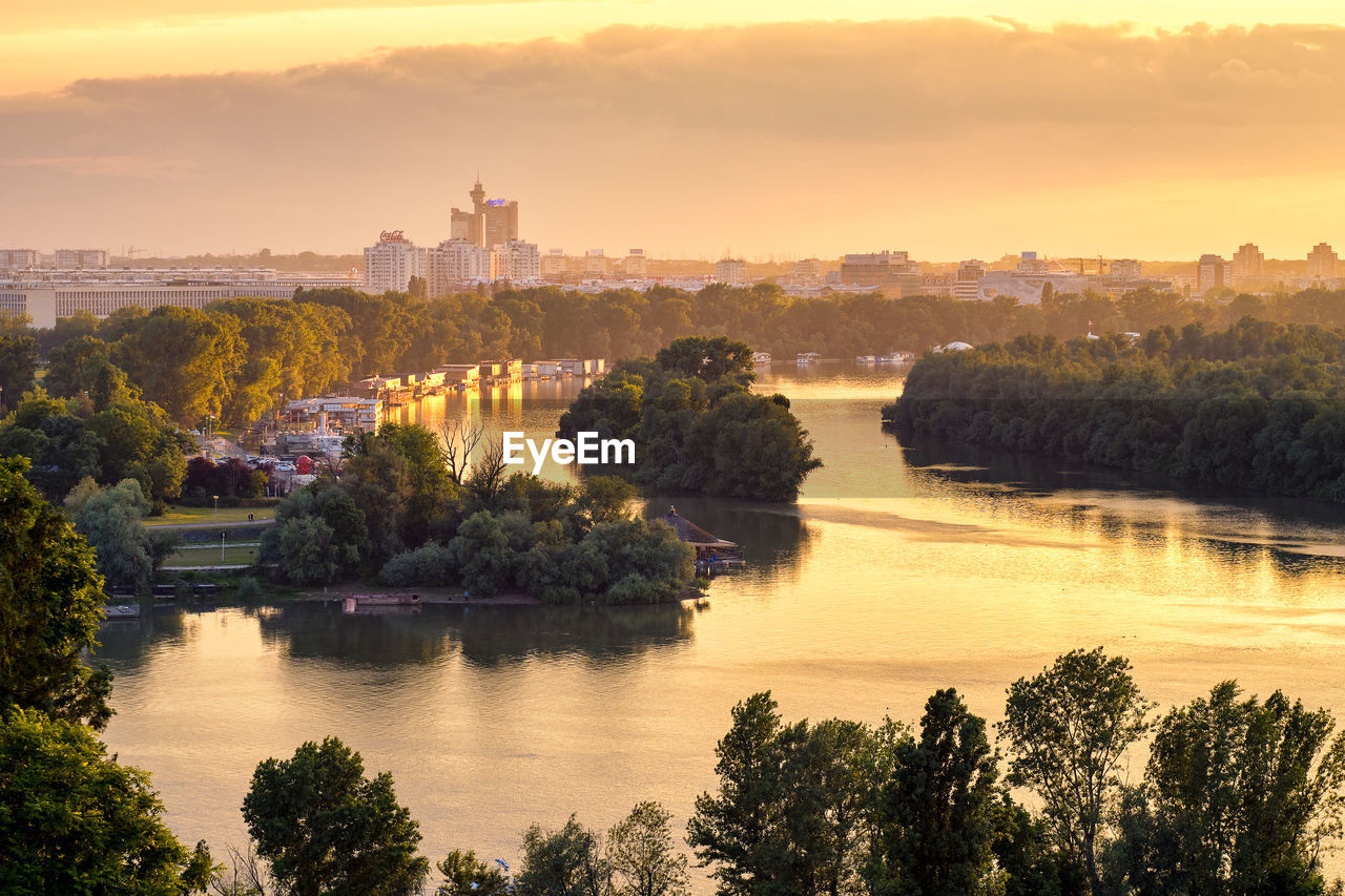 SCENIC VIEW OF RIVER AT SUNSET