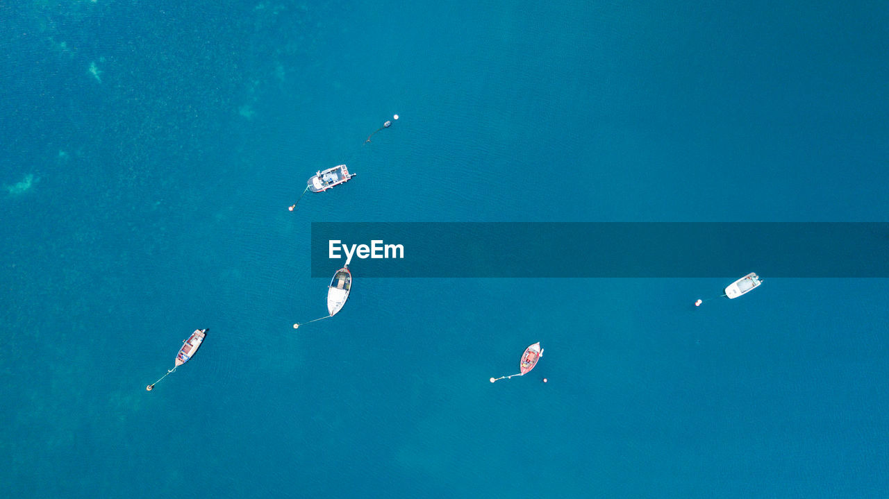 HIGH ANGLE VIEW OF TWO PEOPLE IN SEA