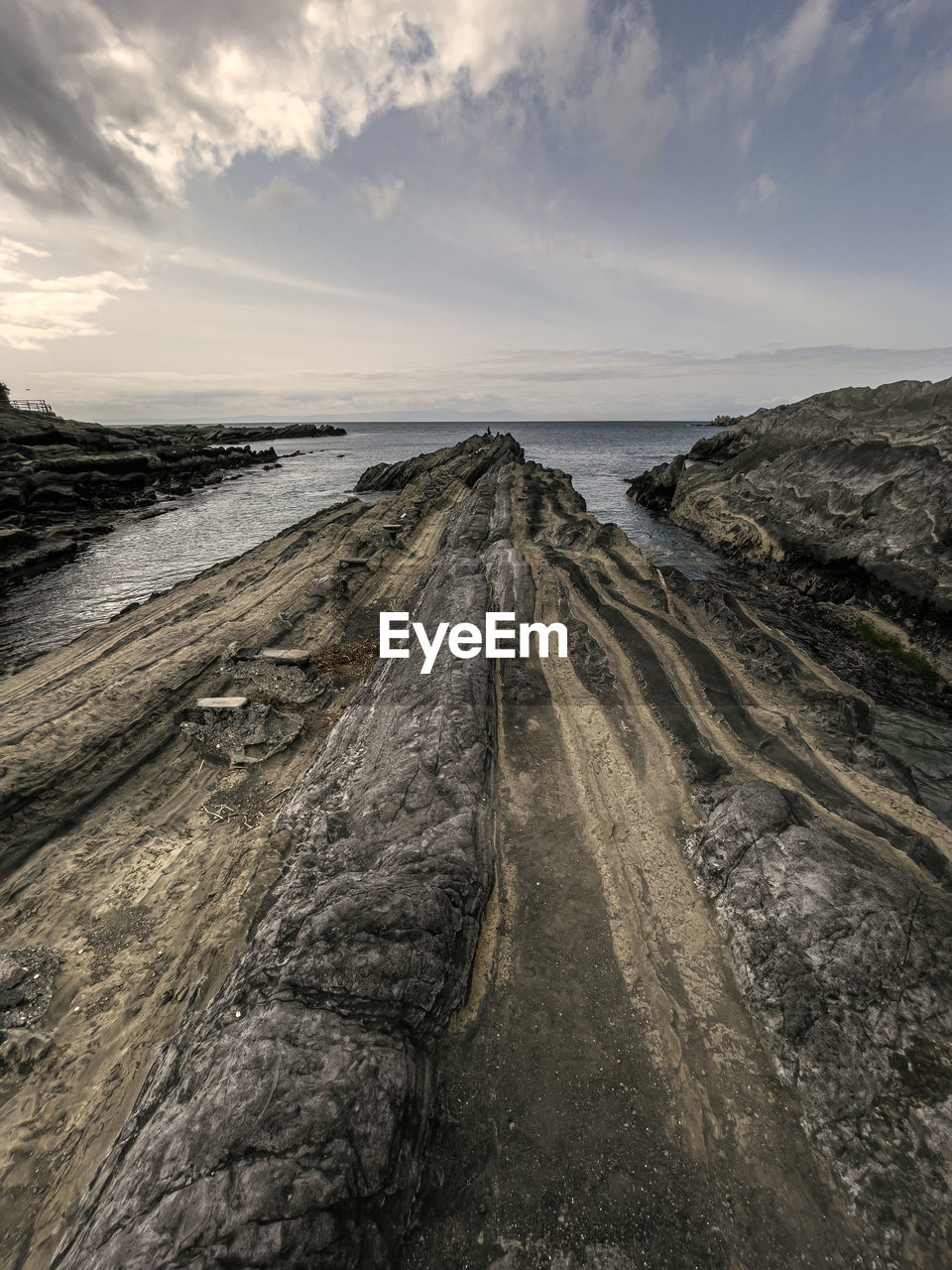 PANORAMIC VIEW OF BEACH AGAINST SKY