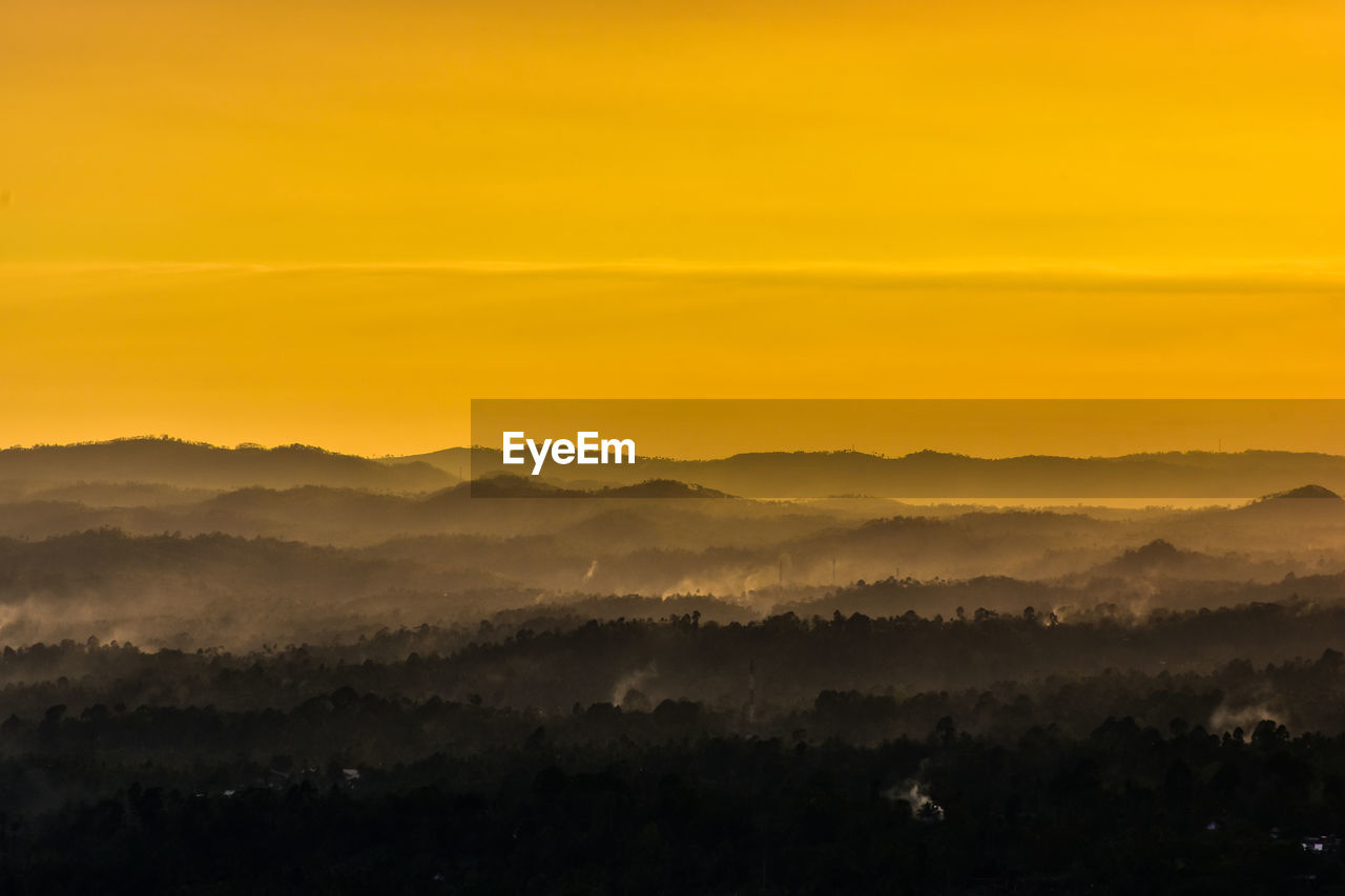 Scenic view of silhouette landscape against sky during sunset