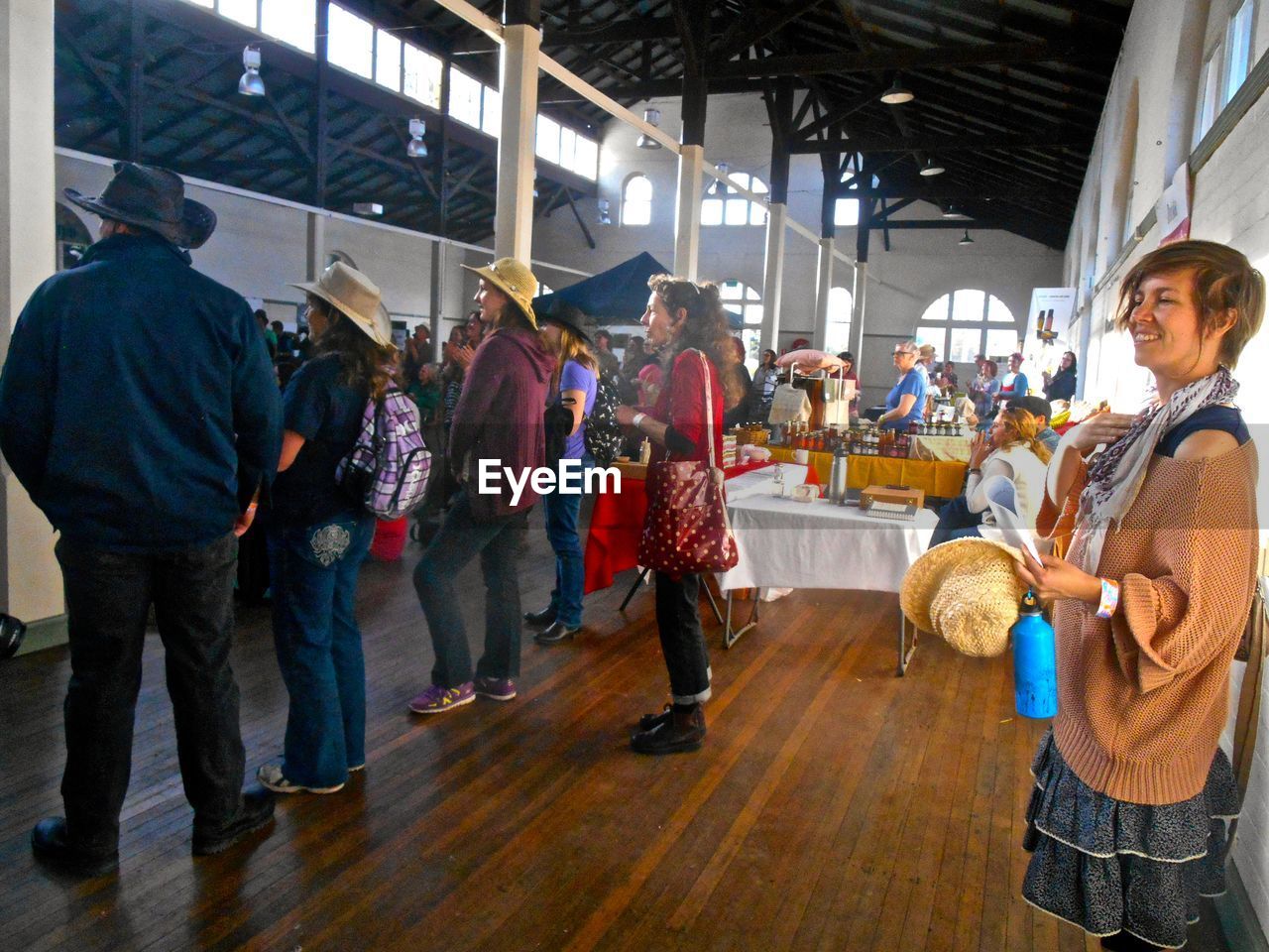 MAN STANDING IN MARKET