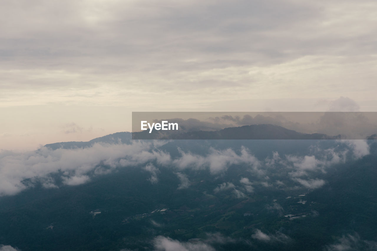 Aerial view of mountains against sky during sunset