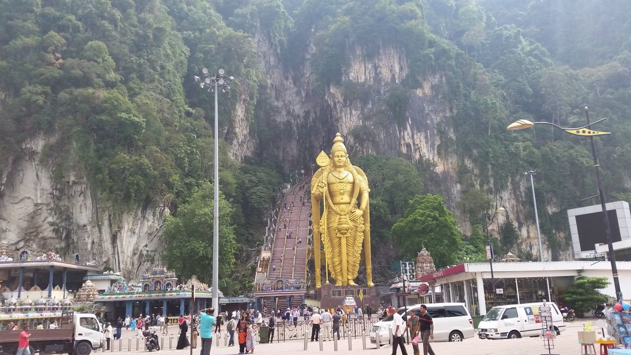 PANORAMIC VIEW OF STATUE AGAINST TREES