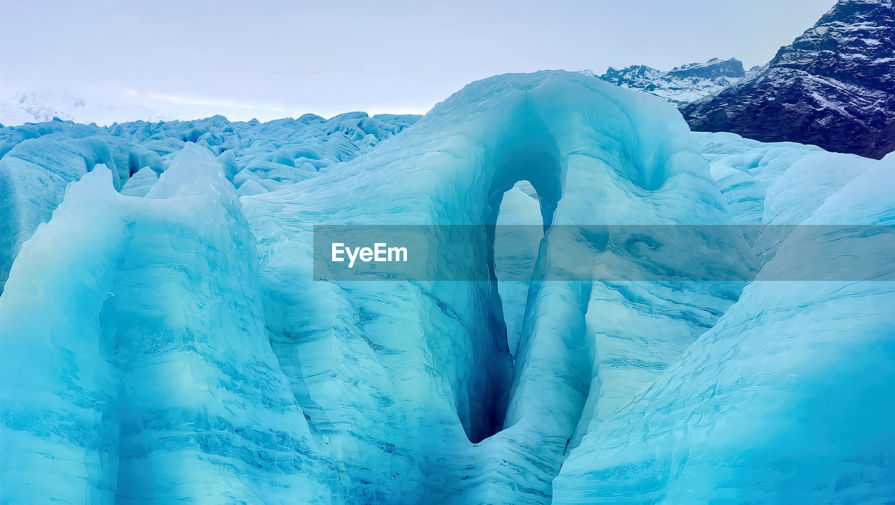 Iceberg floating in greenland fjord.