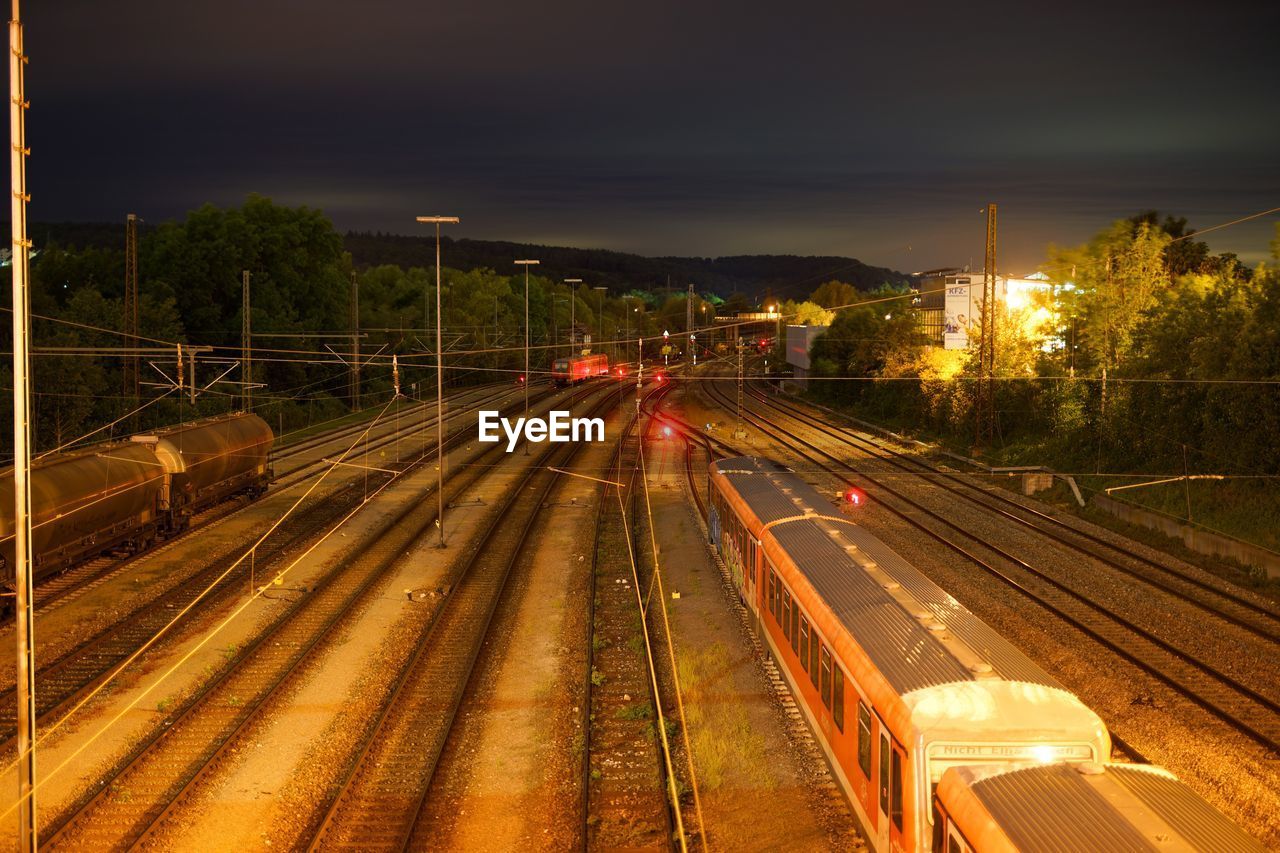 HIGH ANGLE VIEW OF RAILROAD TRACKS AGAINST SKY