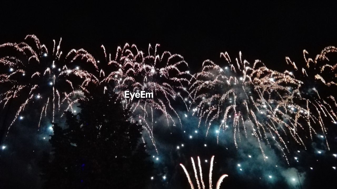 LOW ANGLE VIEW OF FIREWORKS