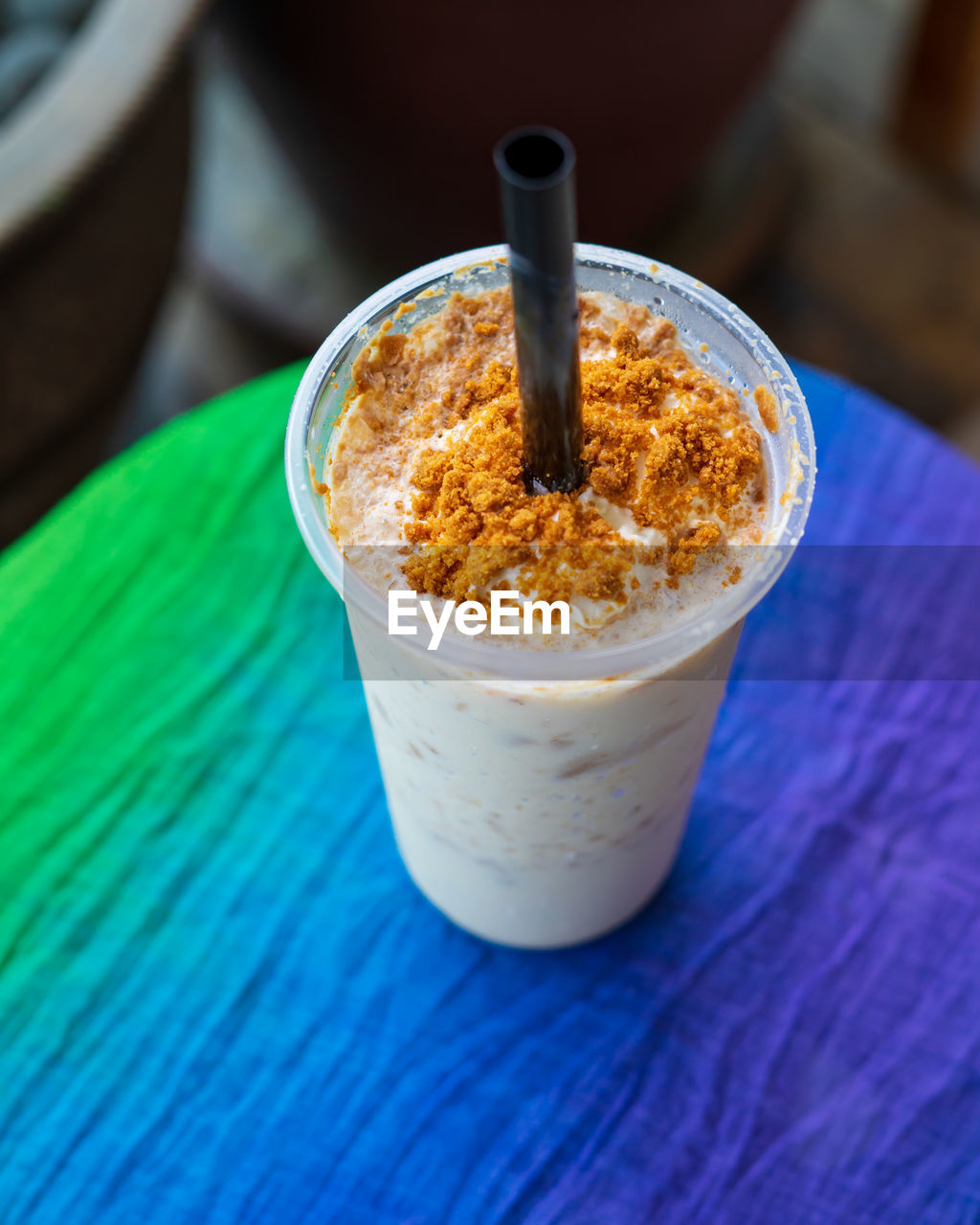 HIGH ANGLE VIEW OF COFFEE ON GLASS TABLE