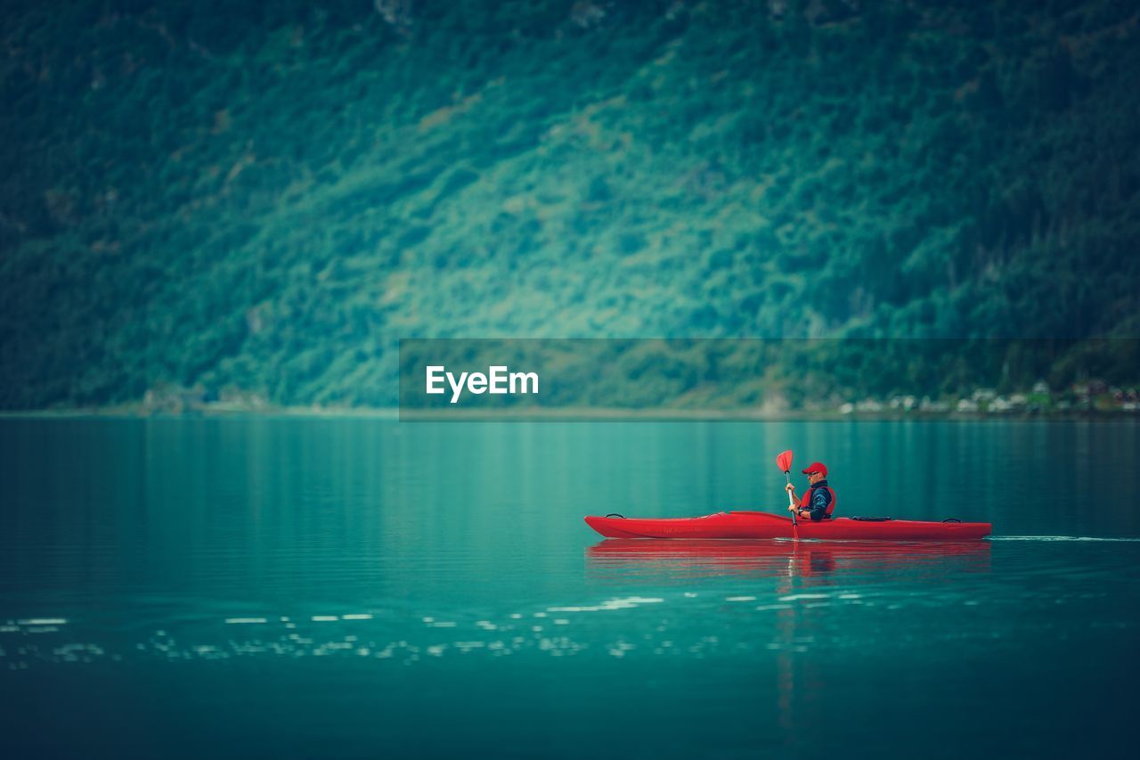 Man kayaking on lake