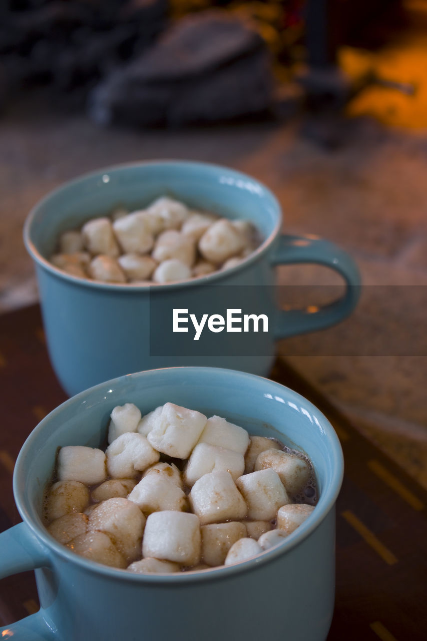 Close-up of toasts in mugs