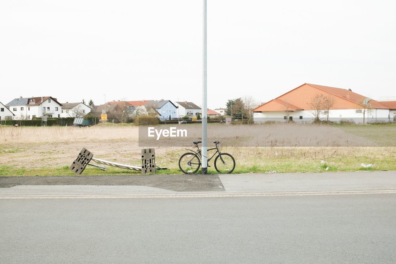 Bicycle parked by road