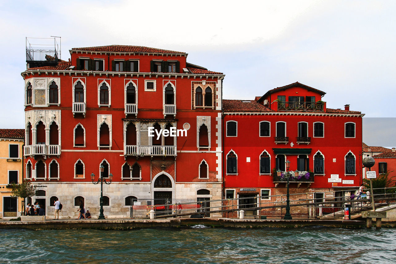 architecture, water, building exterior, built structure, nautical vessel, town, travel destinations, nature, sky, transportation, travel, building, waterway, city, tourism, canal, mode of transportation, sea, waterfront, no people, residential district, house, boat, cloud, outdoors, history, multi colored, vehicle, trip, the past, red, holiday, vacation, day, window, cityscape, gondola