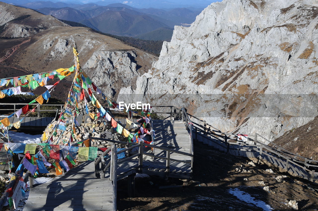 MULTI COLORED UMBRELLAS ON ROCK