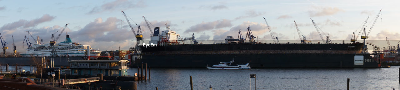 Panoramic view of harbor against sky