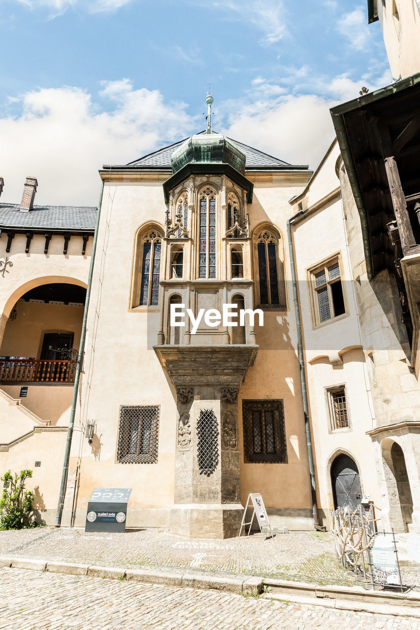 architecture, building exterior, built structure, building, sky, cloud, city, town, window, nature, facade, travel destinations, history, house, ancient history, the past, no people, low angle view, day, religion, urban area, place of worship, outdoors, residential district, sunlight, neighbourhood, travel, old, tourism, belief, street