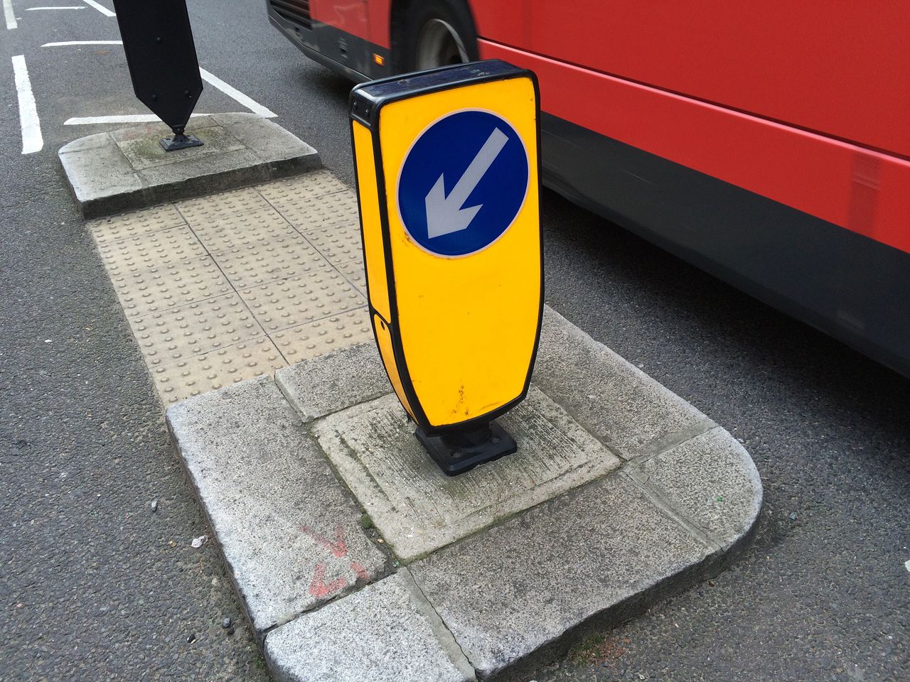 High angle view of arrow symbol on roadside