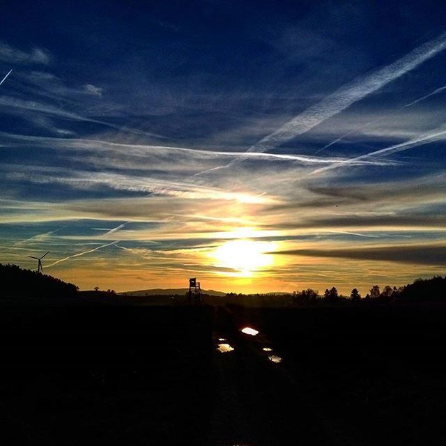 SILHOUETTE OF LANDSCAPE AT SUNSET