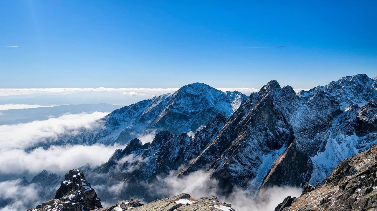 Scenic view of snowcapped mountains against sky