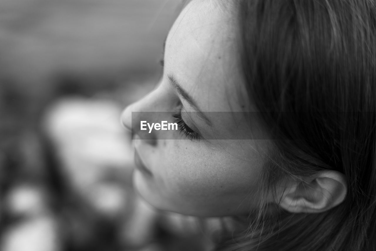 Close-up portrait of woman looking away