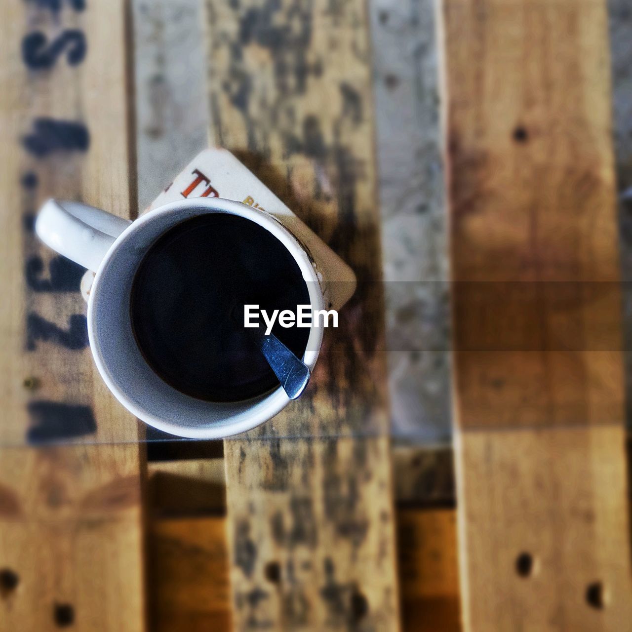 High angle view of black coffee served on table