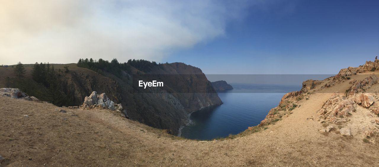 Scenic view of sea against cloudy sky