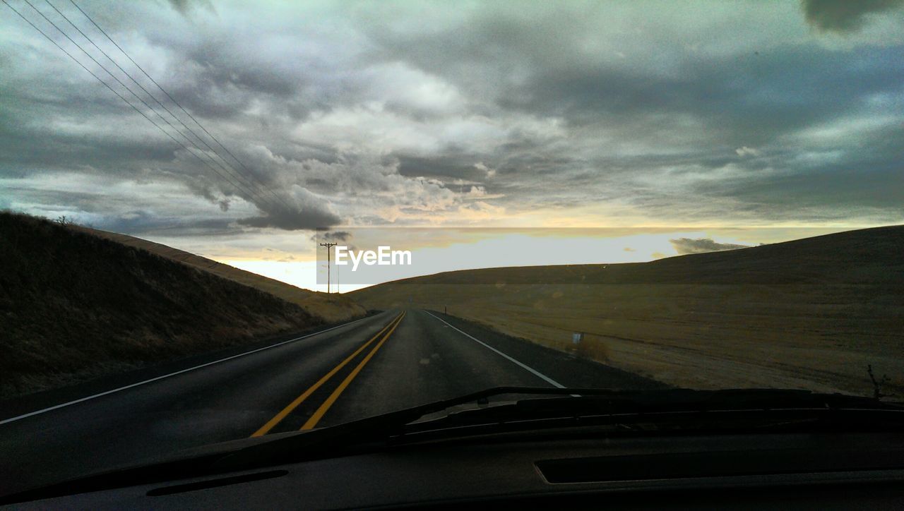 View of empty country road along landscape