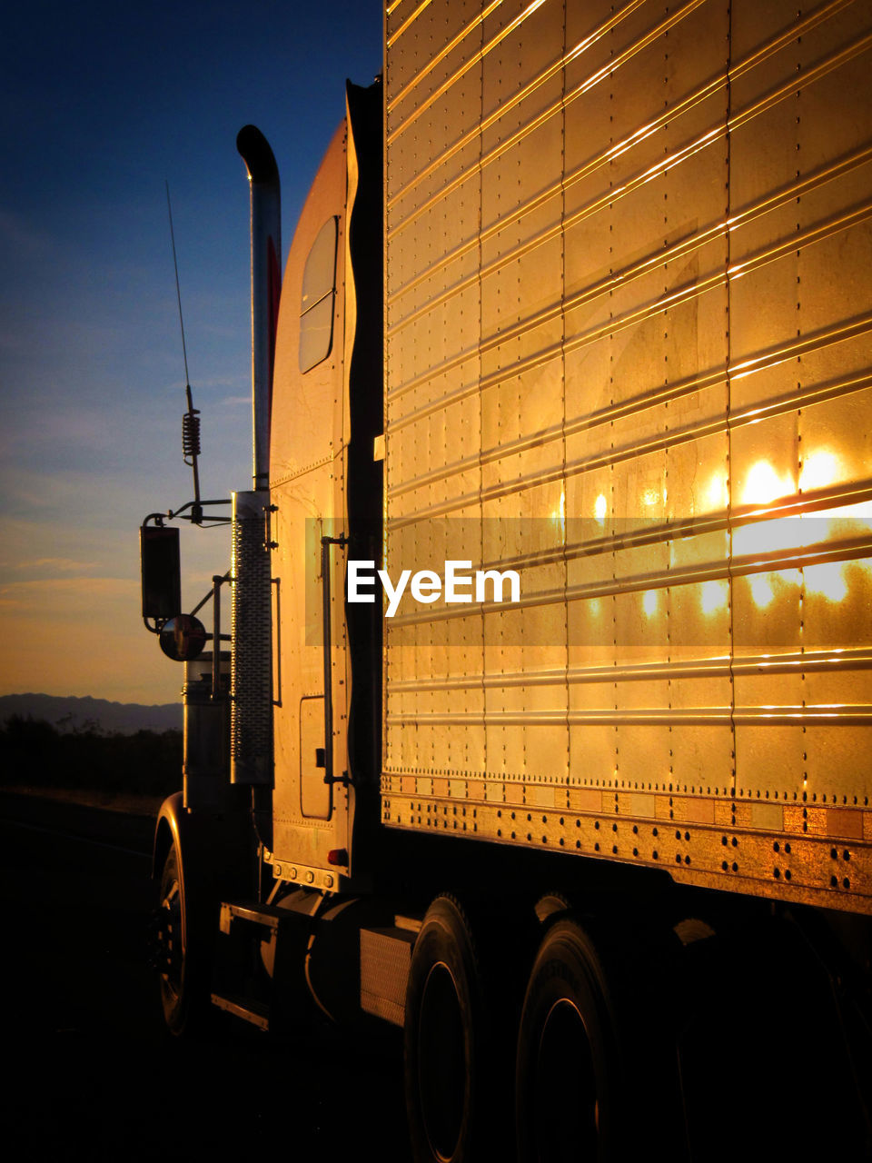 Truck on road against sky